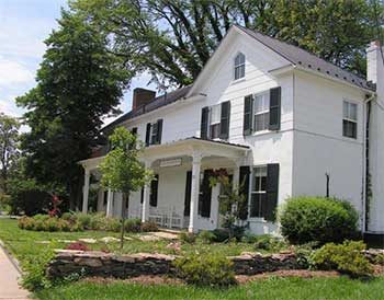 Lauten office building, a restored white house with black metal roof