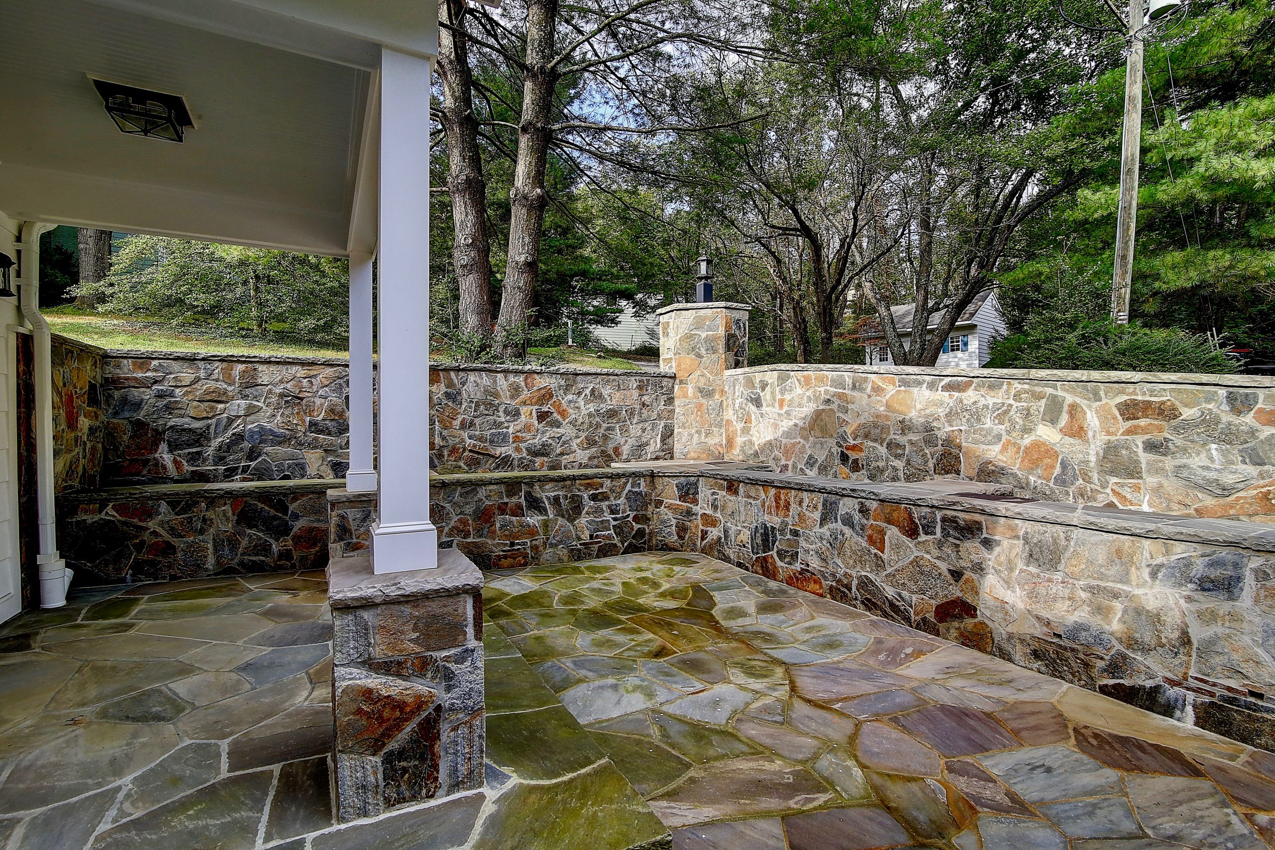 sunken patio with natural stone walls and floor