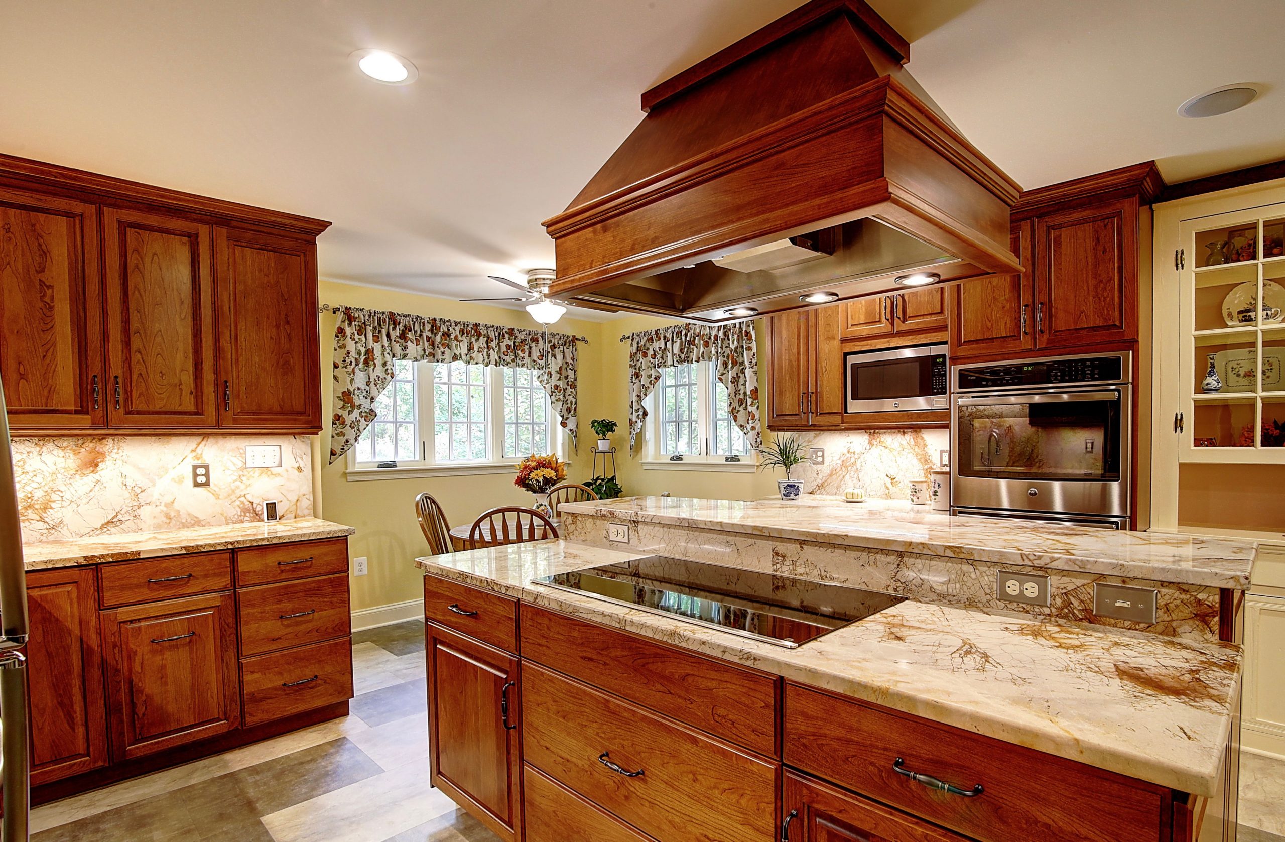 renovated kitchen with traditional wooden cabinets and center island