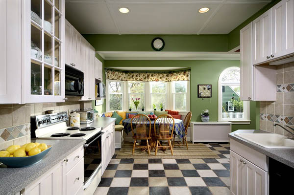 renovated kitchen with green walls and checkerboard flooring
