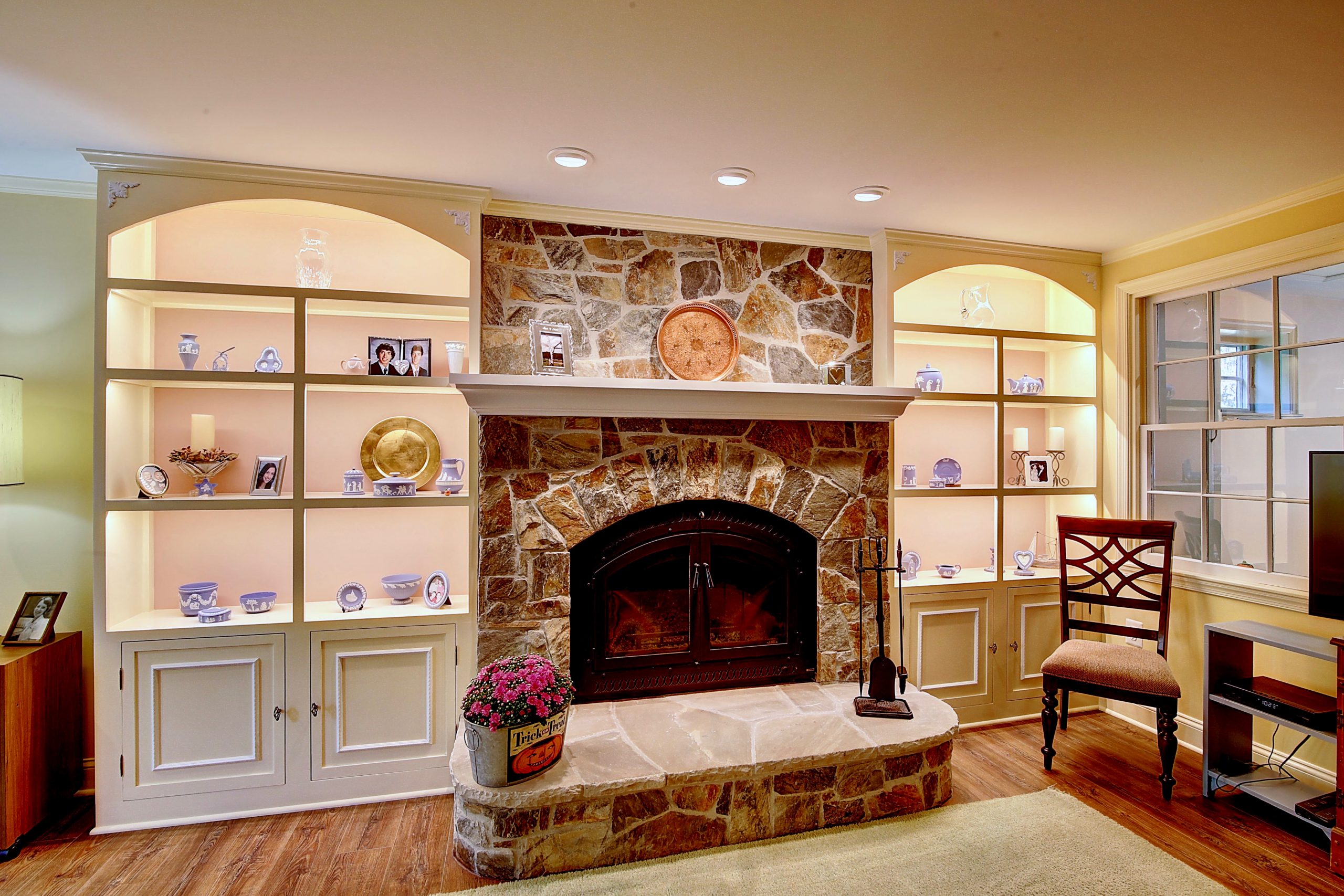 natural stone fireplace and built in shelving