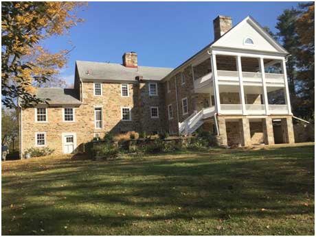 restored historic home with two levels of covered porches